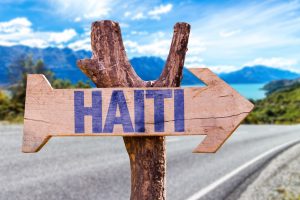 Haiti wooden sign with road background